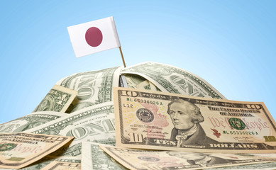 Flag of Japan sticking in a pile of american dollars.(series)