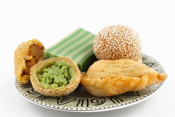 Plate full of asian traditional dessert or snack on white background