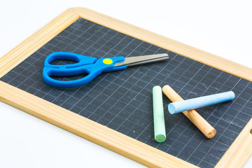colored chalk placed on a school slate