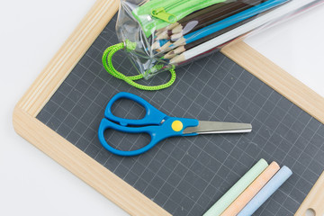 colored chalk placed on a school slate