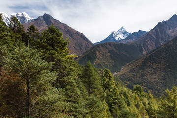 Obraz premium Ama Dablam mountain peaks and deep river canyon.