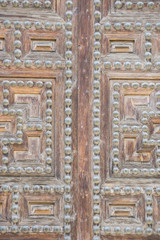 Vintage, old wooden door Castilian style in Toledo Spain