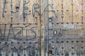 Grunge, old wooden door Castilian style in Toledo Spain