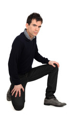 Handsome man doing different expressions in different sets of clothes: kneeling