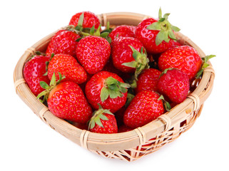 Ripe sweet strawberries in wicker basket, isolated on white