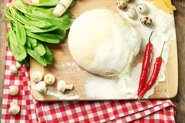 Food ingredients for pizza on table close up