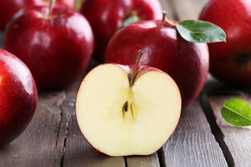 Ripe red apples on table close up