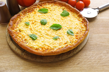 Cheese pizza with vegetables on table close up