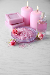 Beautiful composition of spa treatment on white wooden table