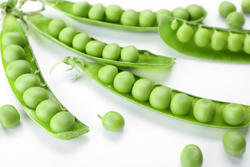 Fresh green peas isolated on white