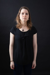 Beautiful woman doing different expressions in different sets of clothes: posing