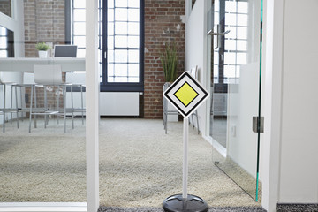 Right of way sign in modern open plan office