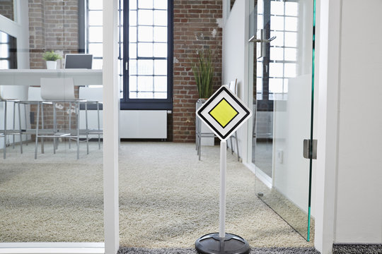 Right of way sign in modern open plan office