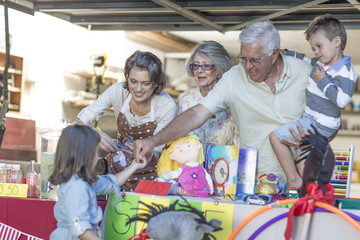 Three generations family having a garage sale