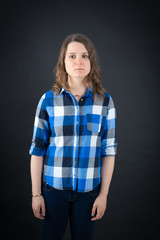 Beautiful woman doing different expressions in different sets of clothes: angry