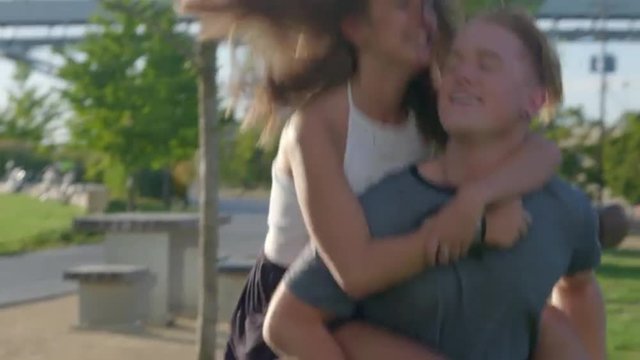 Attractive teens give piggyback rides 