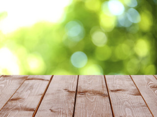 Wooden table  with abstract  blur background