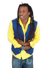 Fototapeta premium Handsome man with dreadlocks doing different expressions in different sets of clothes: stomachache