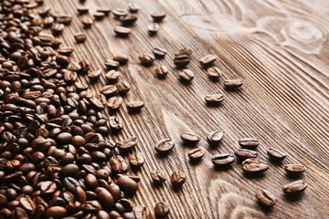 Coffee beans on wooden background