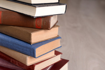 Heap of old books on wooden background