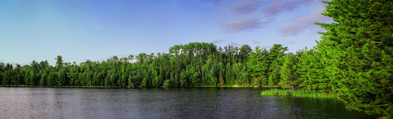 A panoramic image of Lost Lake in Voyageurs National Park, Minnesota, USA. - obrazy, fototapety, plakaty