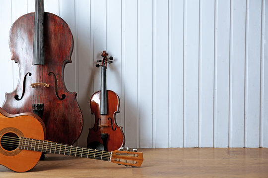 Musical instruments on wooden planks background