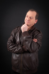 Fototapeta premium Handsome man doing different expressions in different sets of clothes: thinking