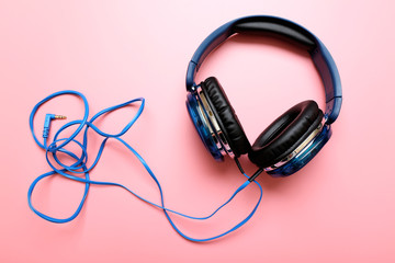 Headphones on pink background