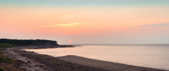 Fototapeta premium Panoramic view of sunset at Northumberland Strait near the Confederation Bridge mainland New Brunswick