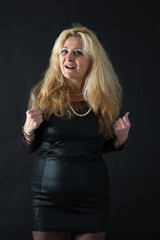 Fototapeta premium Beautiful woman man doing different expressions in different sets of clothes: arms raised