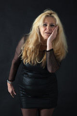 Fototapeta premium Beautiful woman man doing different expressions in different sets of clothes: toothache