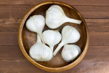 Rustic style Garlic (peeled) on vintage wooden background