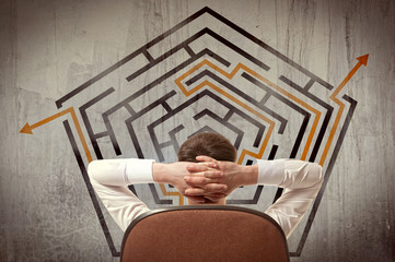 Businessman looking at a maze