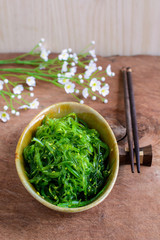Traditional Japanese seaweed salad with chopsticks
