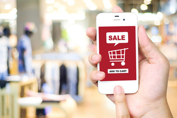 Sale and shopping on line concept on smart phone screen over blu
