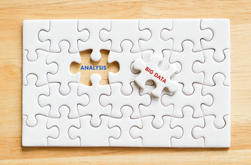 Big data and analysis words on jigsaw puzzle background