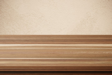 Empty wooden table over brown cement wall background, product di