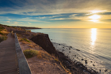 Fototapeta na wymiar Pathway along the coast at sunset