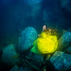 The girl with a violin under water