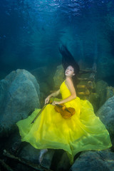 The girl with a violin under water