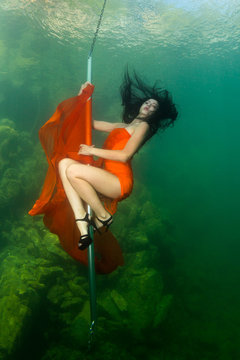 Underwater striptease