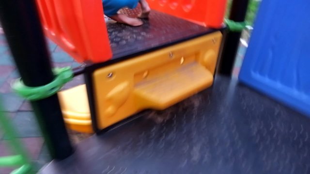 camera follows cute boy plays on playground, first person view