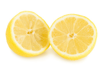 Close-up of a ripe lemon cut in half, isolated on white background.