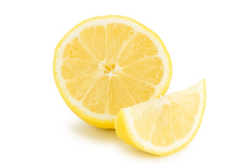 Close-up of half and quarter slices of lemon, isolated on white background.
