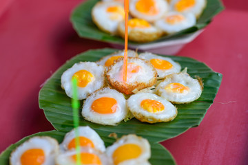 Quail eggs on banana leaf.
