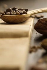 roasted coffee beans on old vintage open book. Menu, recipe, mock up. Wooden background.