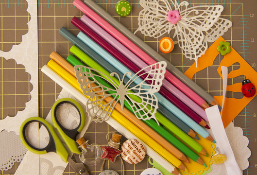Scrapbooking and art background with tools, elements, colored pe