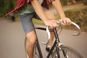 Fototapeta premium Close up shot of Hipster on bike at the city 