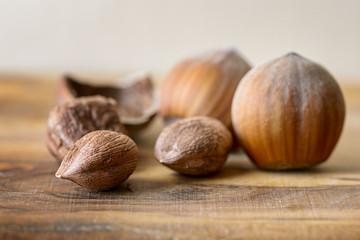 hazelnut and nutshell on wood