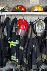 Fototapeta premium Firefighter Suits And Helmets At Fire Station